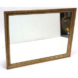 An early Victorian gilt gesso rectangular picture frame converted to a wall mirror, 48” x 36”.