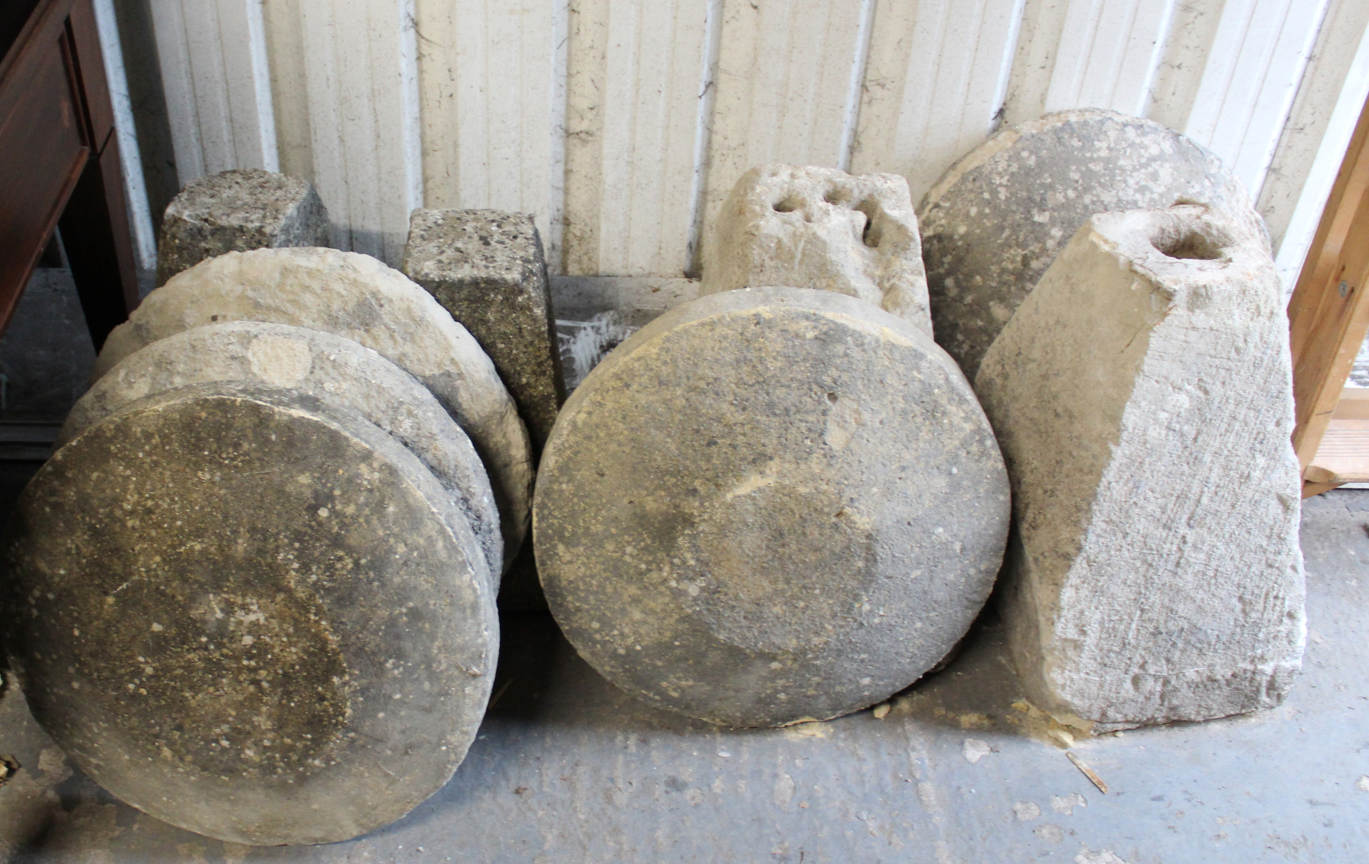 Four cast-stone staddle stones (various sizes); & a staddle stone top, part w.a.f.