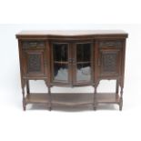 A late Victorian Jas. Schoolbred & Co. mahogany bow-front side cabinet, with enclosed cupboard to