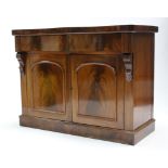 A 19th century mahogany serpentine-front chiffonier, fitted frieze drawer above cupboard enclosed by