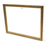 A large gilt frame rectangular wall mirror with raised scroll border, & inset bevelled plate, 34”