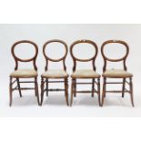 A set of four late 19th century balloon-back occasional chairs with padded sets, & on turned legs