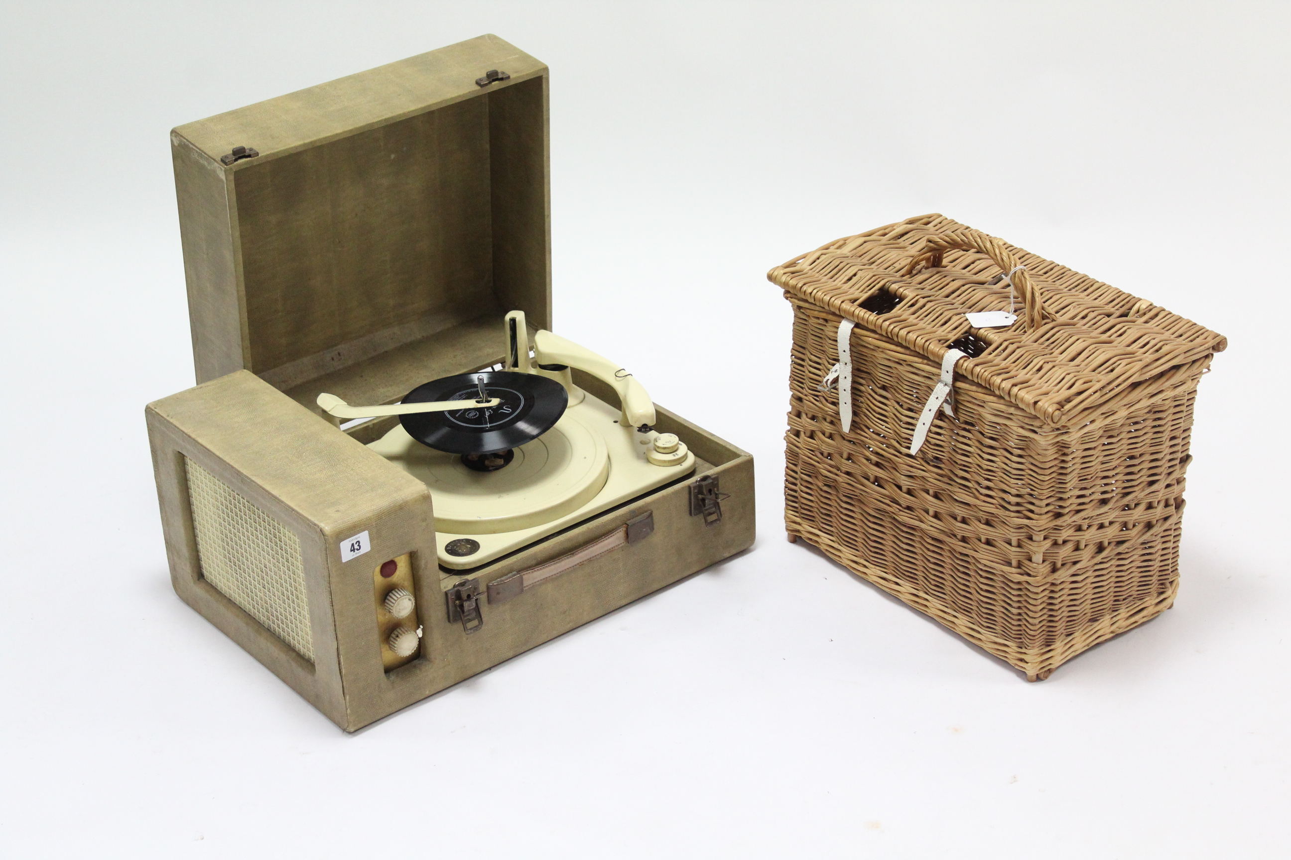 A Monarch fibre-covered portable turntable in fibre-covered case; & a wicker basket.