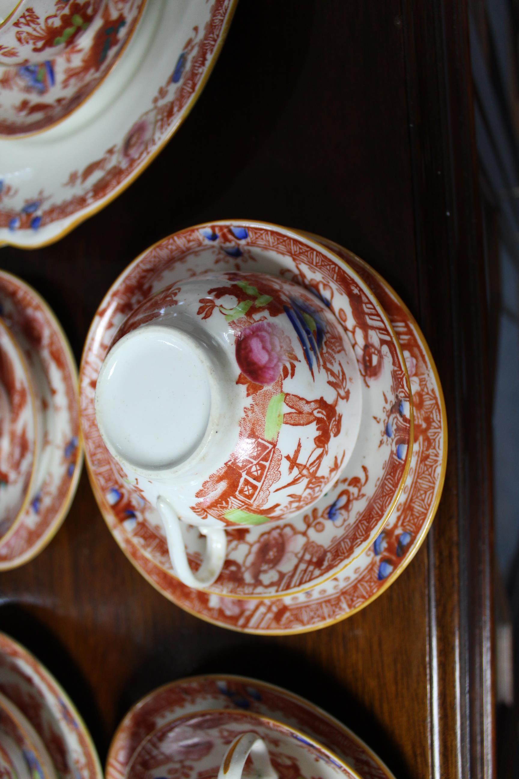 A Victorian china thirty-six piece part tea service with oriental village scene decoration. - Image 3 of 3