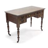 A Victorian mahogany kneehole dressing table, fitted five drawers with brass swing handles, & on