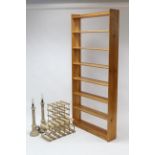 A pine tall standing eight-tier open bookcase, 33” wide x 75” high; together with two wine
