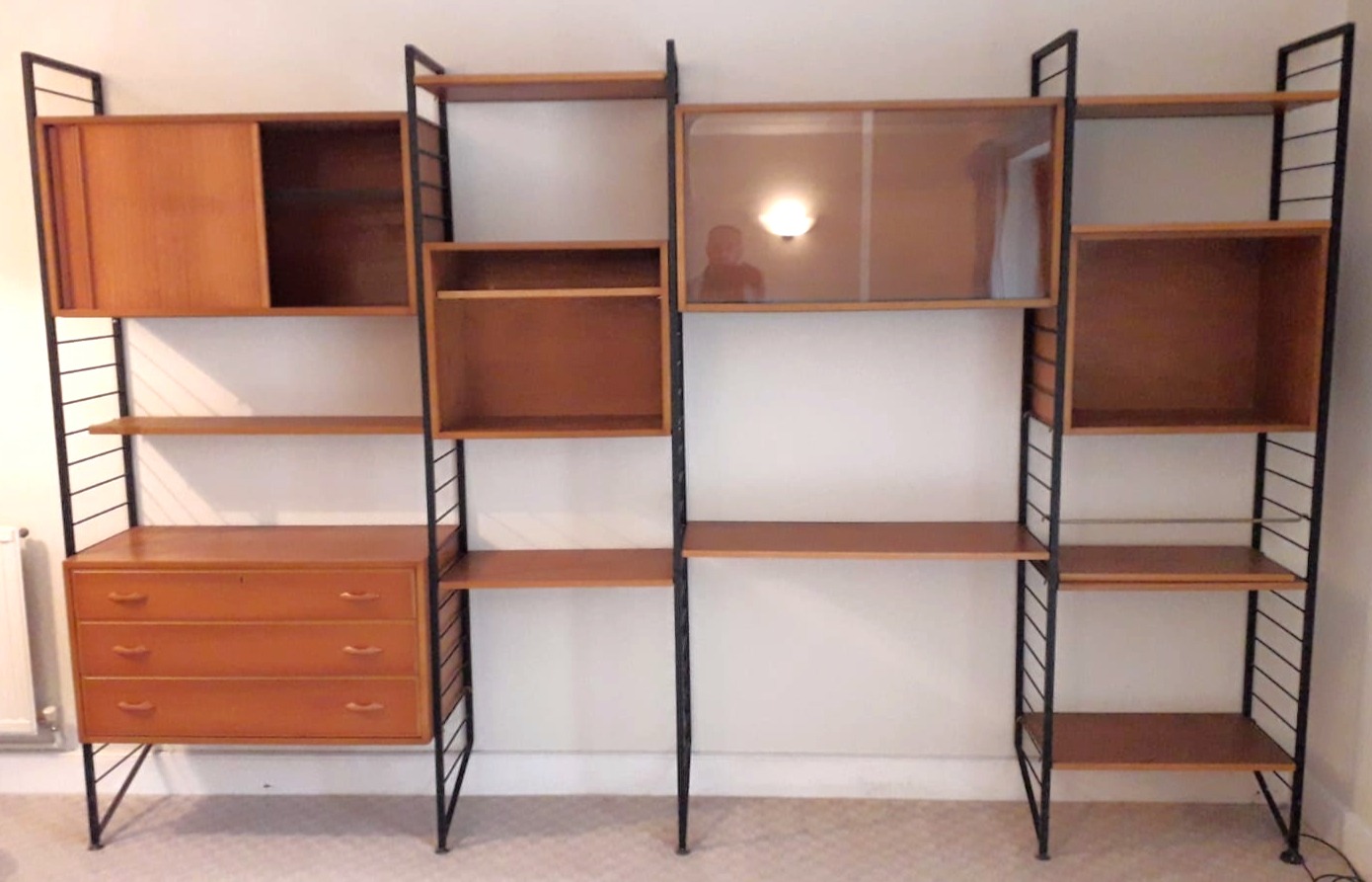 A LADDERAX-TYPE TEAK INTER-CHANGEABLE TALL WALL UNIT, fitted with an arrangement of drawers,