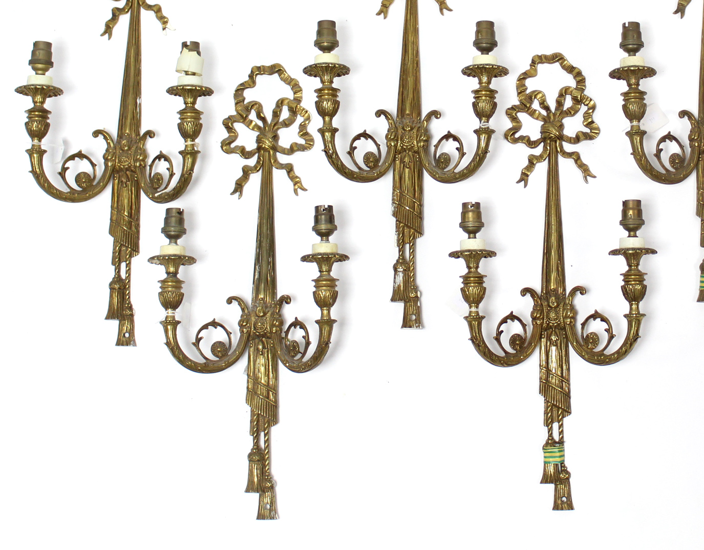 A set of six antique gilt-metal twin-branch wall scones, 10½” wide x 23½” high.