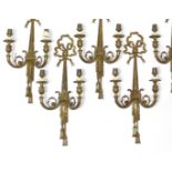 A set of six antique gilt-metal twin-branch wall scones, 10½” wide x 23½” high.