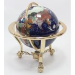 A 12” diam. terrestrial globe on brass-finish stand.