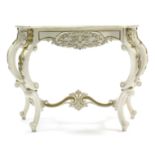 A Louis XIV-style cream & gold painted wooden serpentine-front console table on four carved cabriole