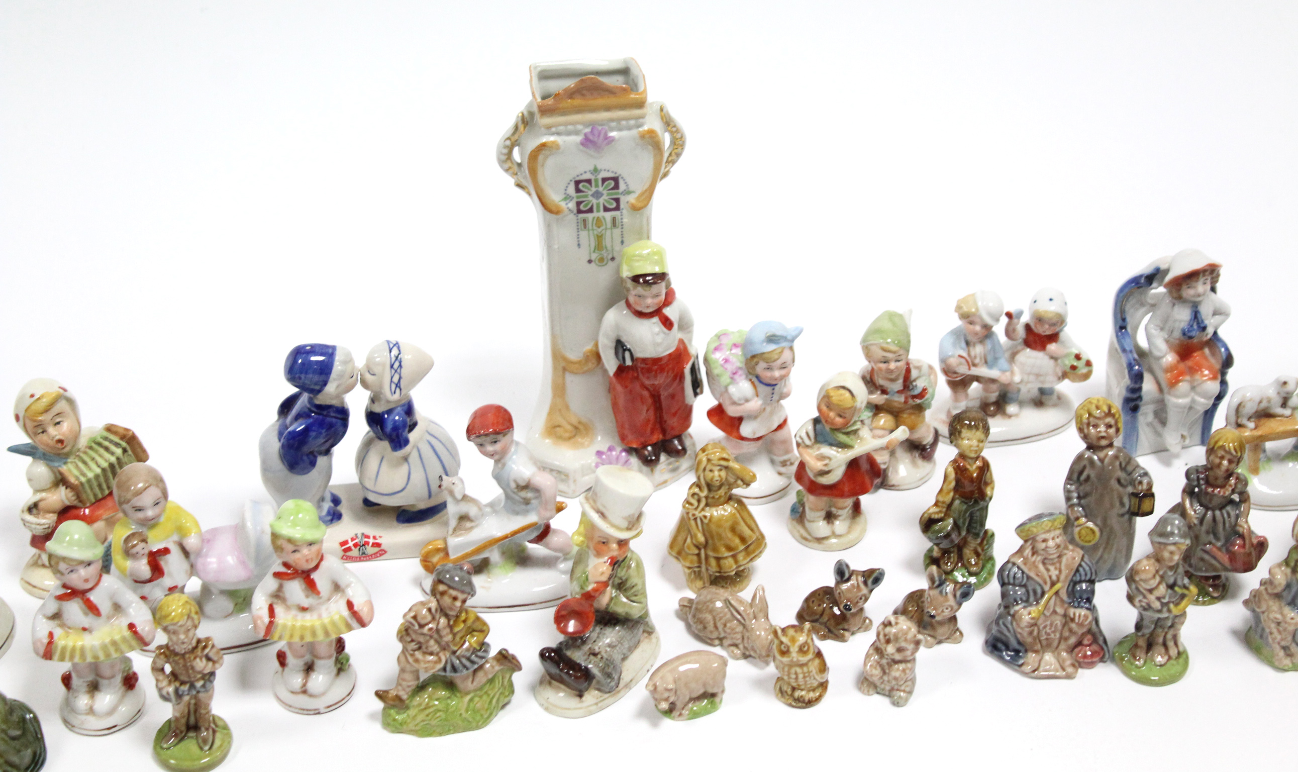 Approximately twenty various china figure ornaments.