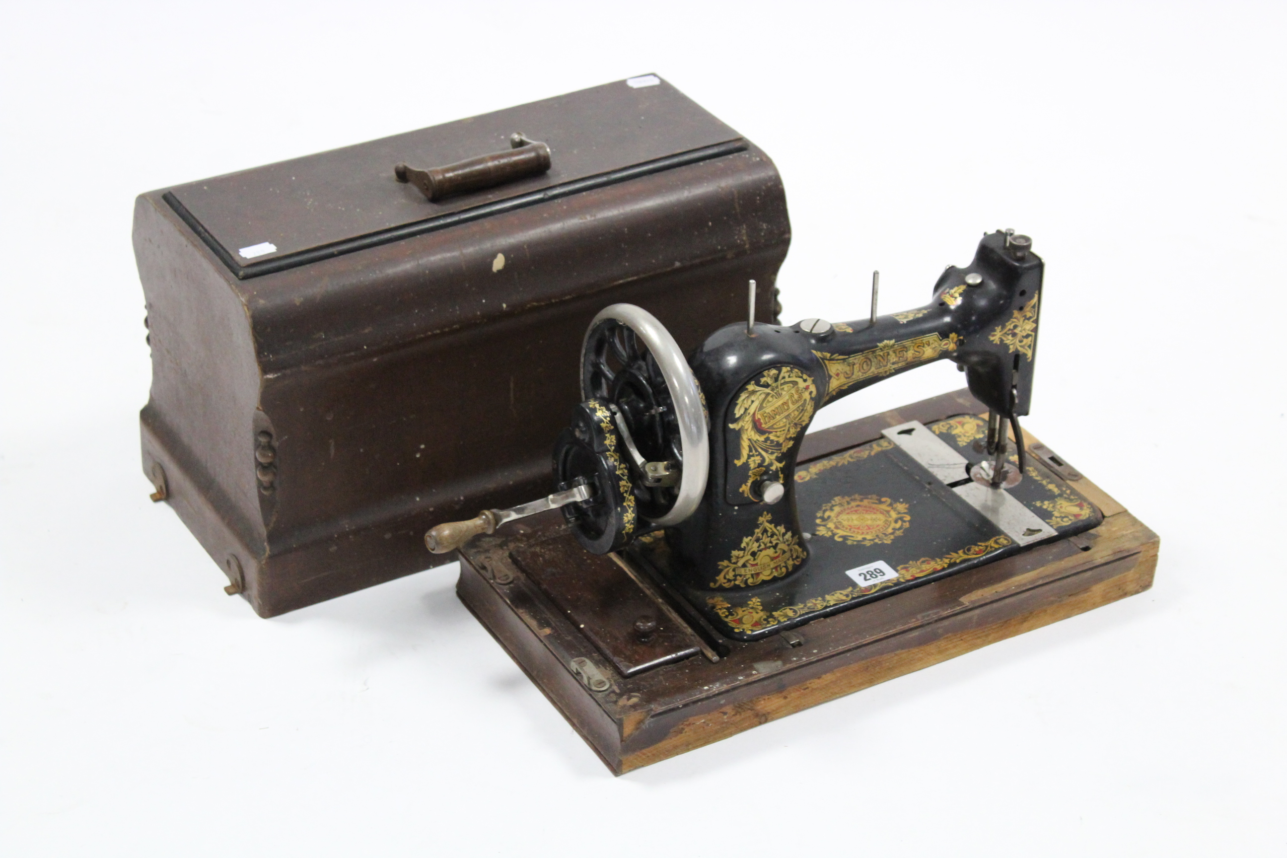 A vintage Jones hand-sewing machine with case.