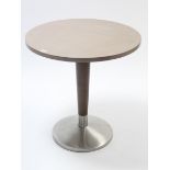 A chrome & dark brown finish kitchen table with light brown finish circular top, 27½” diameter.