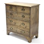 A pine chest, fitted two short & three long graduated drawers with brass oval swing handles, & on