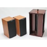 A pair of B & W hi-fi speakers; & a mahogany-finish revolving DVD stand.