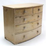 A Victorian pine bow-front chest, fitted two short & three long graduated drawers with turned knob