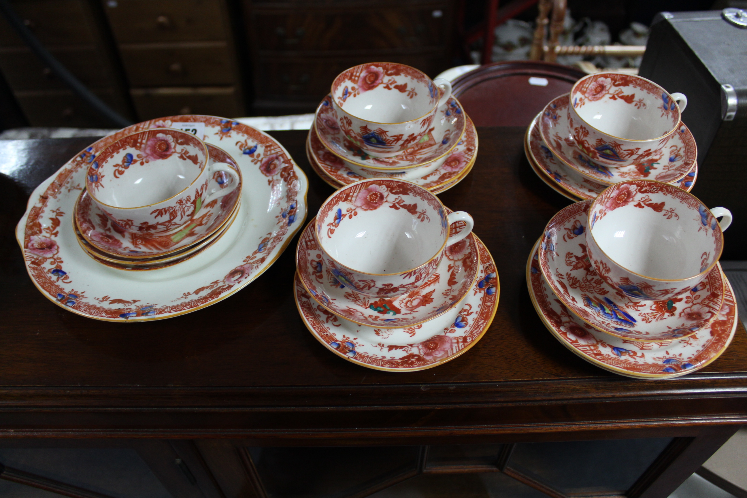 A Victorian china thirty-six piece part tea service with oriental village scene decoration.