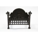 A cast-iron fire grate with raised urn design to the rounded back, 24” wide x 18” high.