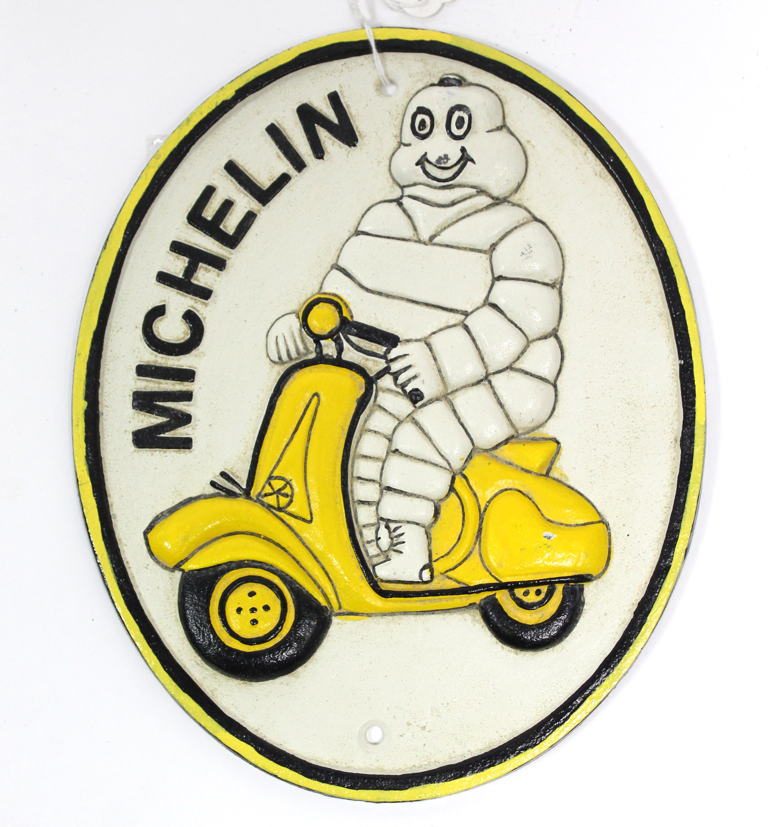 A reproduction painted cast-iron oval sign “MICHELIN”, 9½” x 7¾”.