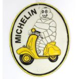 A reproduction painted cast-iron oval sign “MICHELIN”, 9½” x 7¾”.