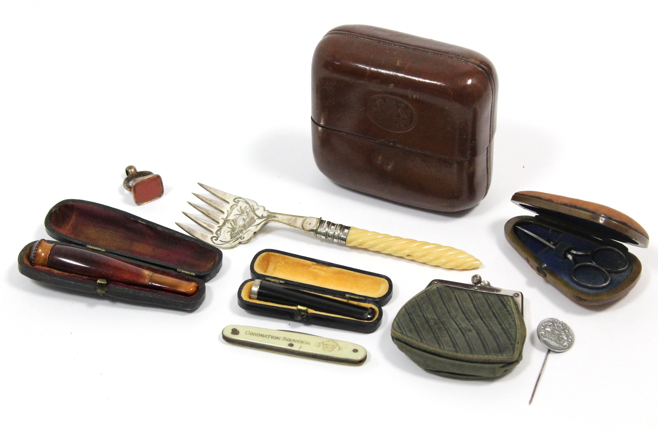 Two cigarette holders; a fob seal; a small purse, etc.