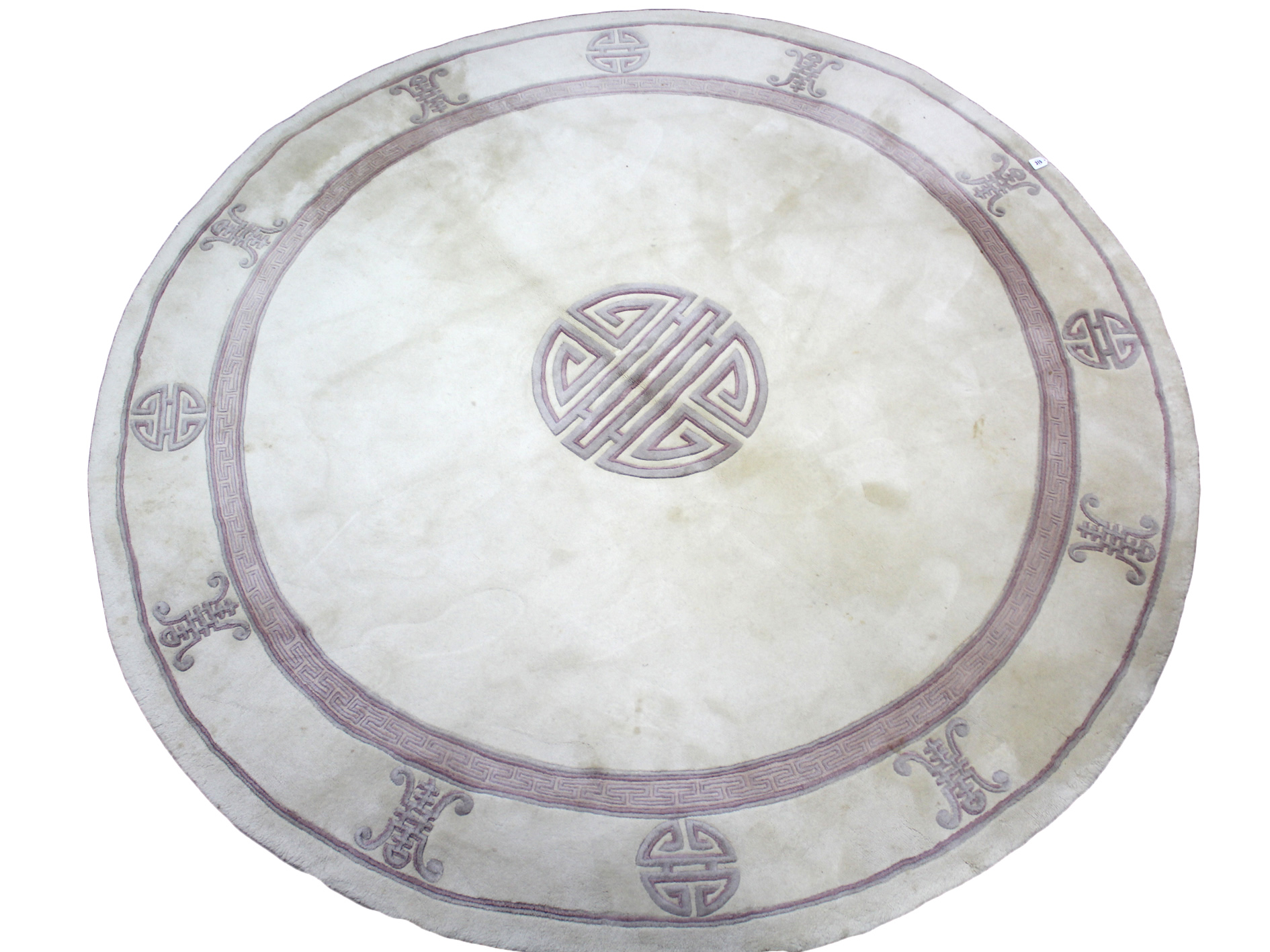 A modern Chinese wool pile circular rug of cream ground, & with repeating geometric design, 8’