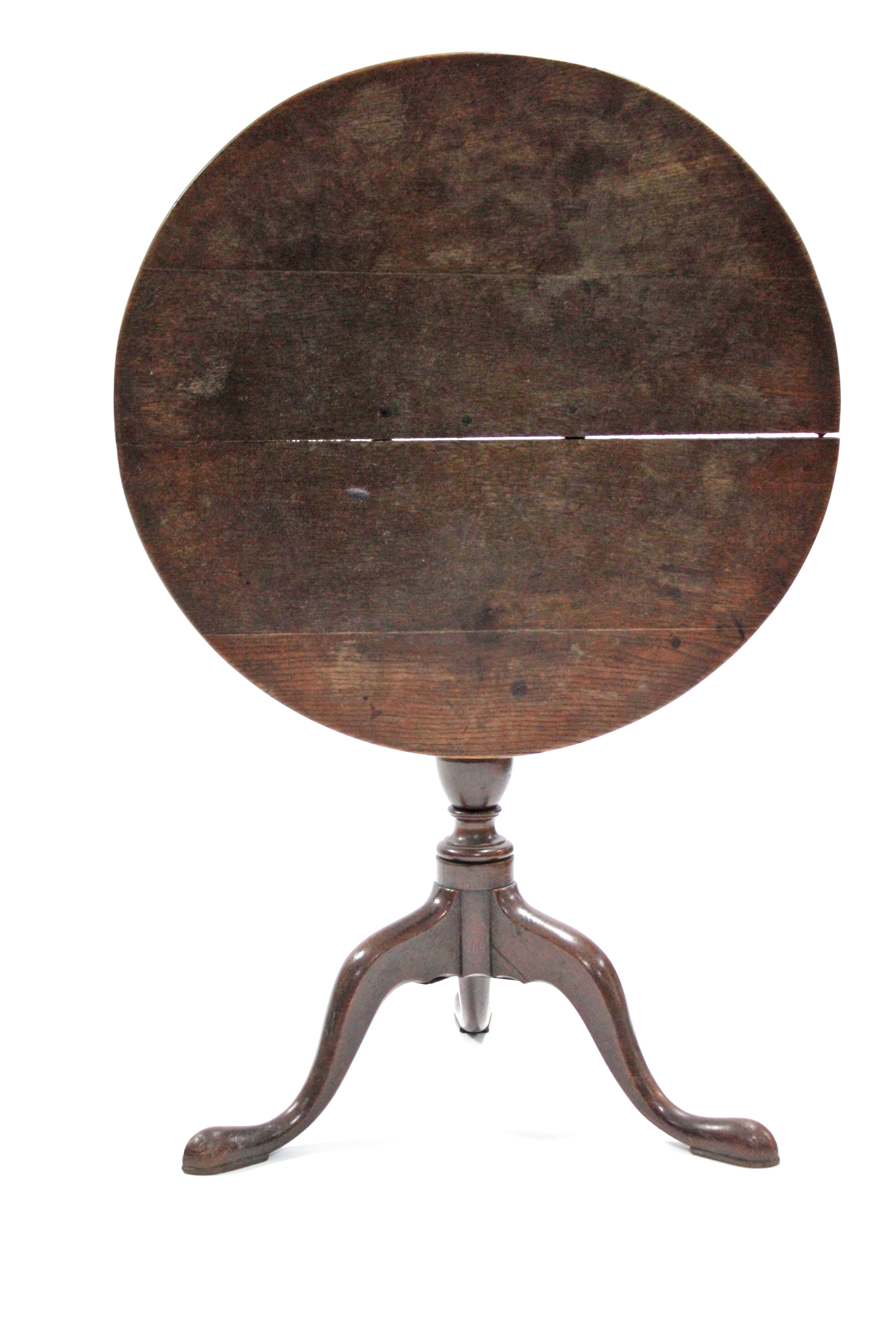 A late 18th century oak tripod table, with circular tilt-top on vase-turned centre column & cabriole