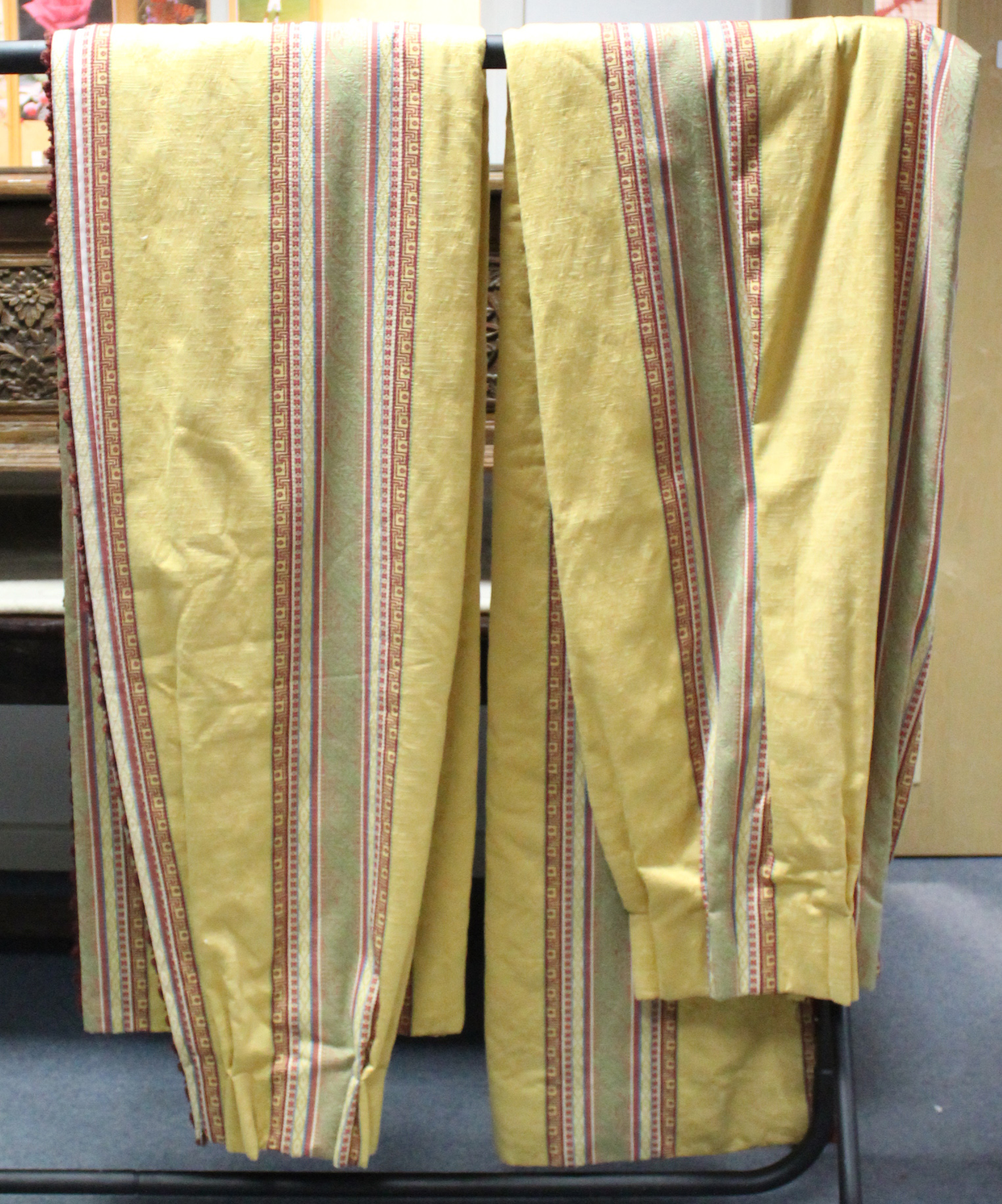 A pair of old gold & crimson damask lined &interlined curtains with floral design & striped