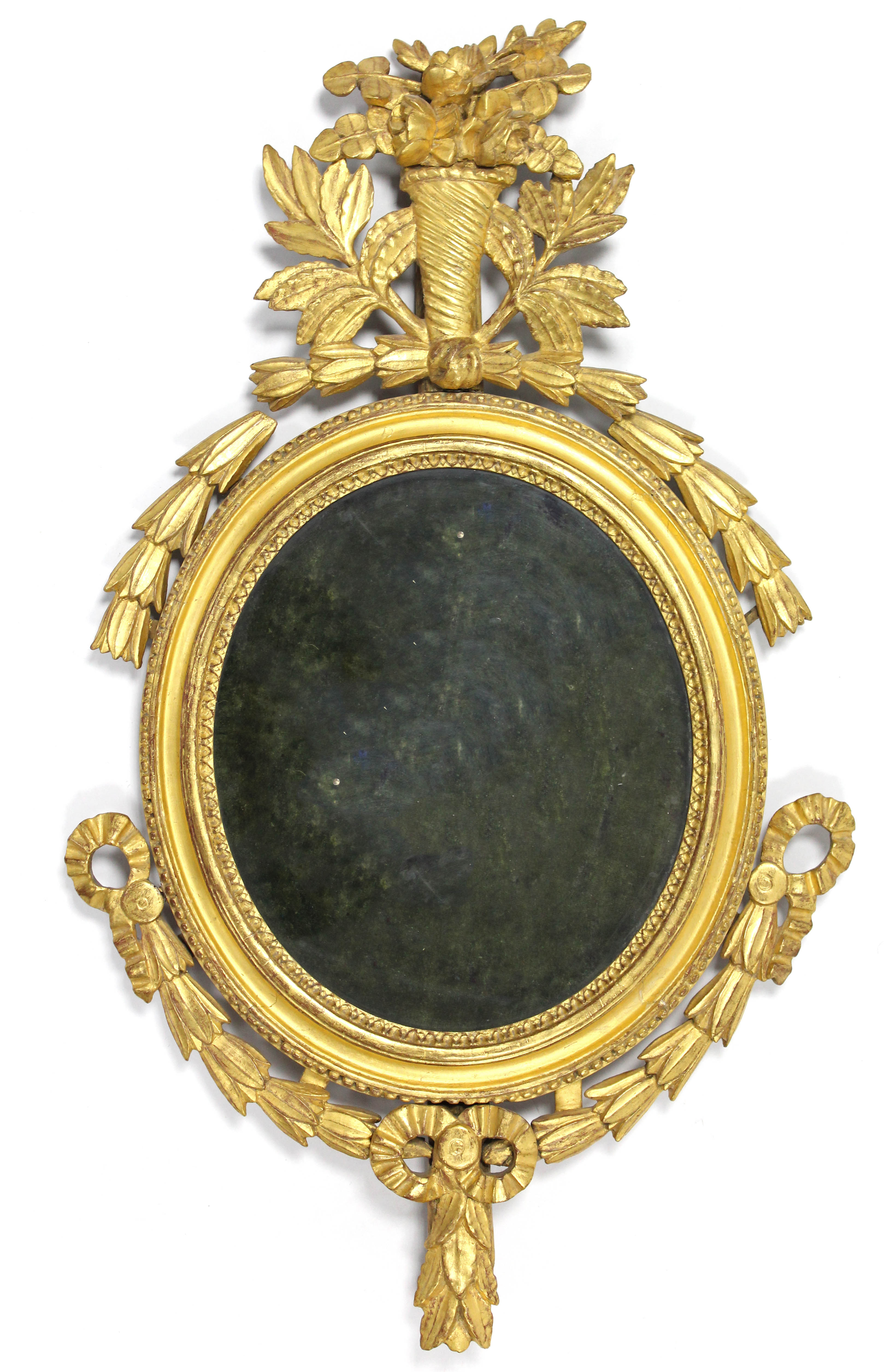 A LATE 18th century CARVED GILTWOOD OVAL FRAME FOR DISPLAYING PORTRAIT MINIATURES, with floral,
