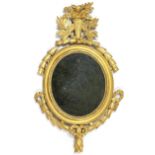 A LATE 18th century CARVED GILTWOOD OVAL FRAME FOR DISPLAYING PORTRAIT MINIATURES, with floral,