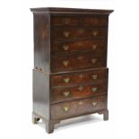 A LATE 18th century OAK CHEST-ON-CHEST, with cavetto cornice, fitted two short & six long