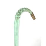 An unusual Victorian pale green glass walking cane of square tapered section, the spiral-twist