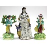 An early 19th century Staffordshire pearlware standing figure of a sportsman with his rifle, on oval