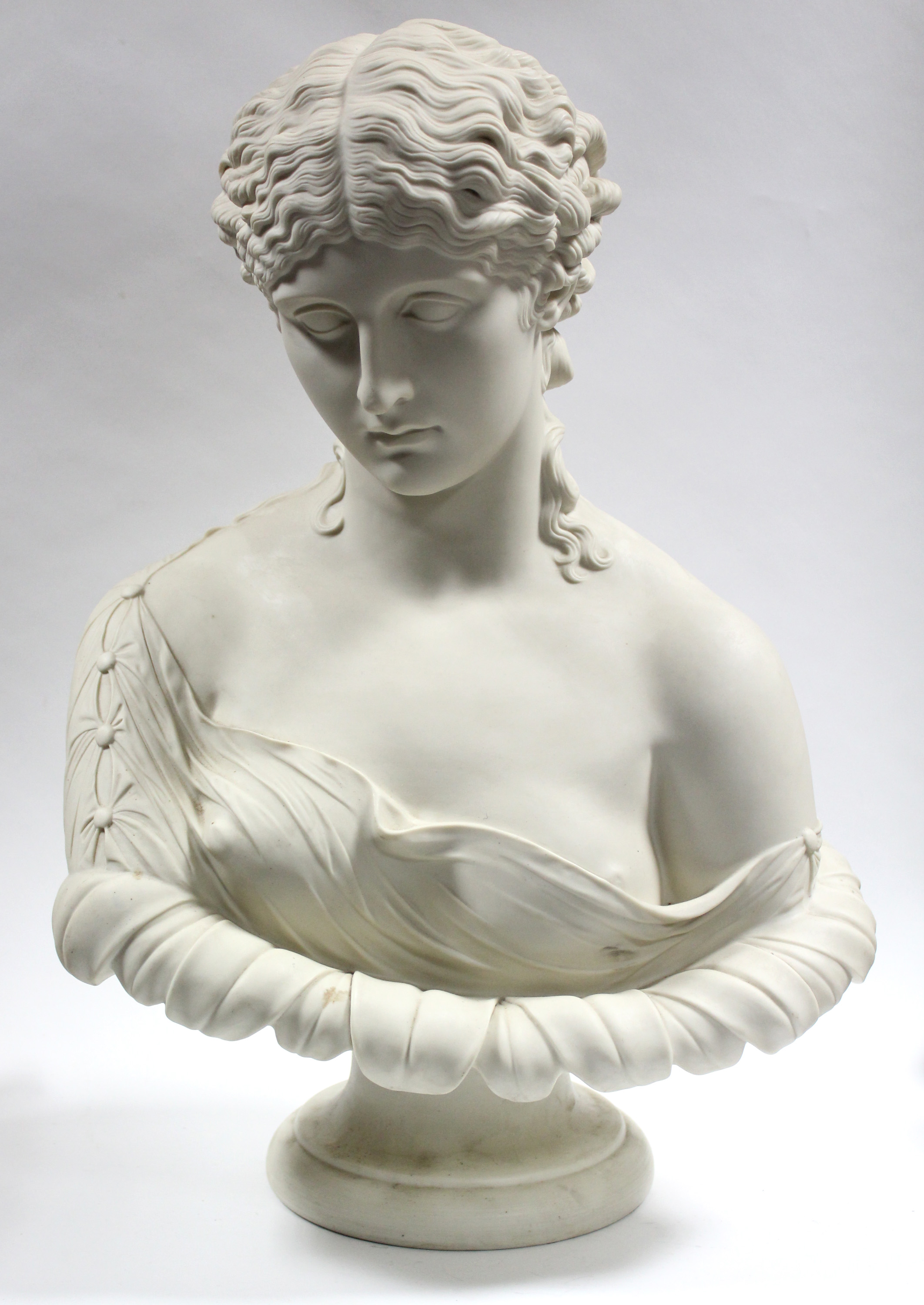 A LARGE COPELAND PARIAN BUST OF CLYTE, after the antique, circa 1876, on round socle, impressed