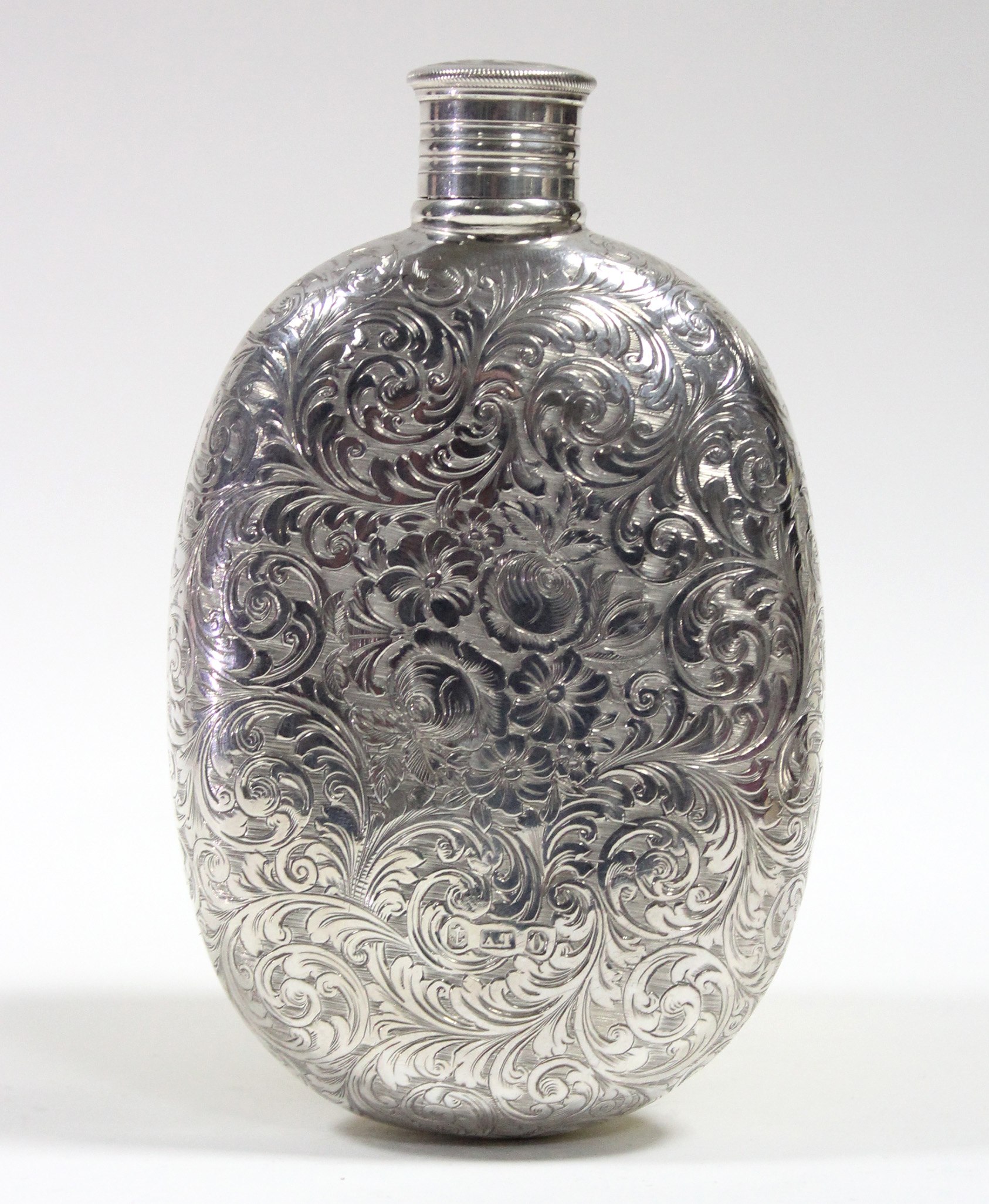 A Victorian silver oval flat-sided pocket spirit flask with all-over engraved decoration of leaf- - Image 2 of 3