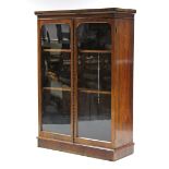 A Victorian mahogany bookcase, fitted two adjustable shelves enclosed by pair of glazed panel