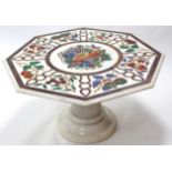 A 20th century Pietra Dura octagonal marble low table, decorated with exotic fruit in coloured