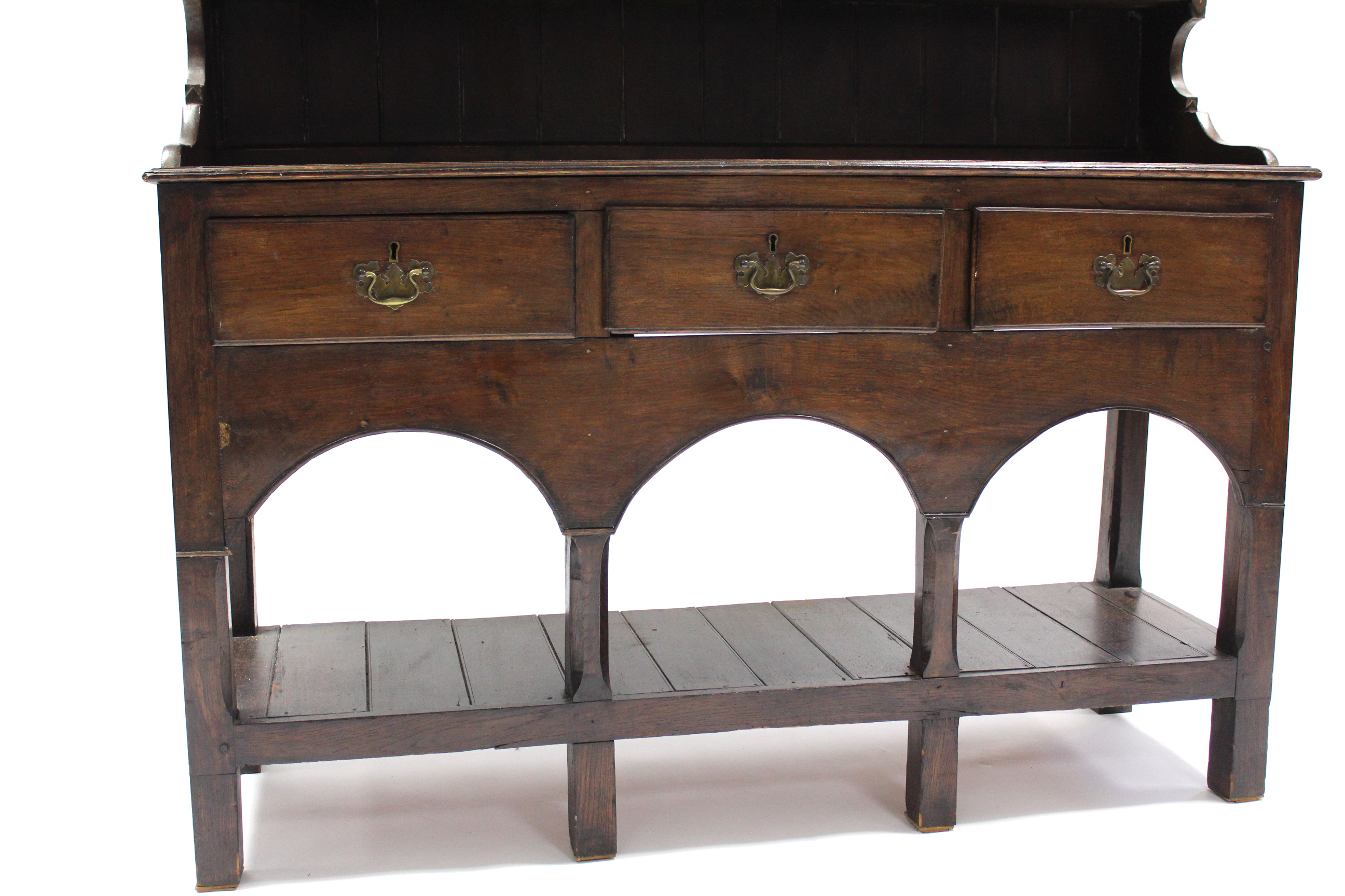 AN 18th century OAK DRESSER, fitted three shelves above three frieze drawers with shaped brass swing - Image 2 of 4