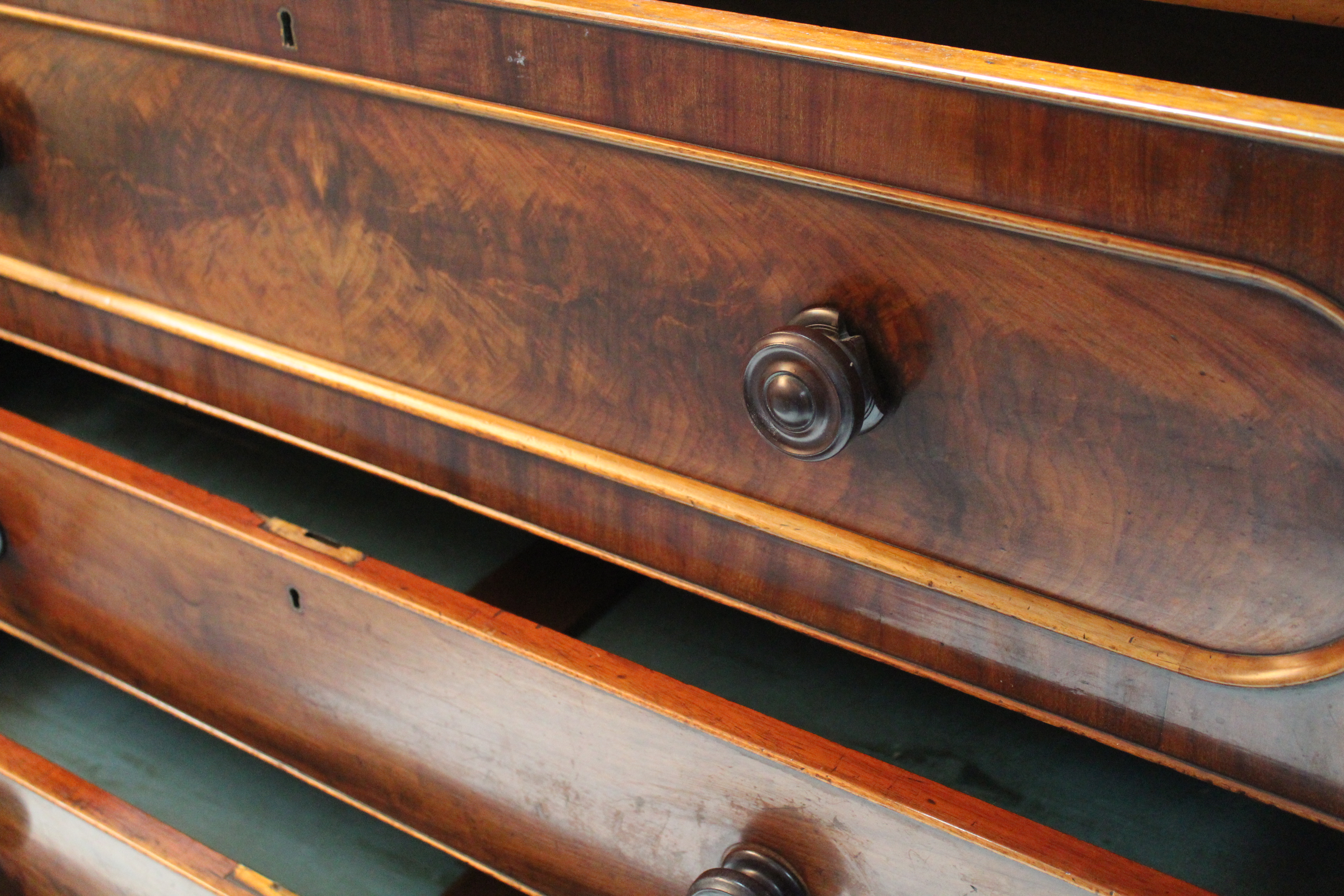 A mid-Victorian figured mahogany chest of four long graduated drawers with turned wooden - Image 3 of 4