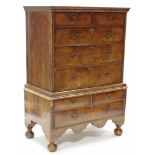 AN EARLY 18th century WALNUT CHEST-ON-STAND, with moulded cornice, fitted two short & three long