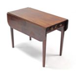 A George III figured mahogany Pembroke table, the rectangular top with rounded corners, fitted end