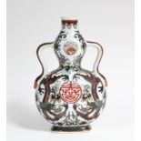 A Chinese porcelain double-gourd pilgrim flask, decorated with dragons amongst foliage in brown &