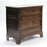 An 18th century oak chest, fitted four long graduated drawers with moulded edges, & brass swan-