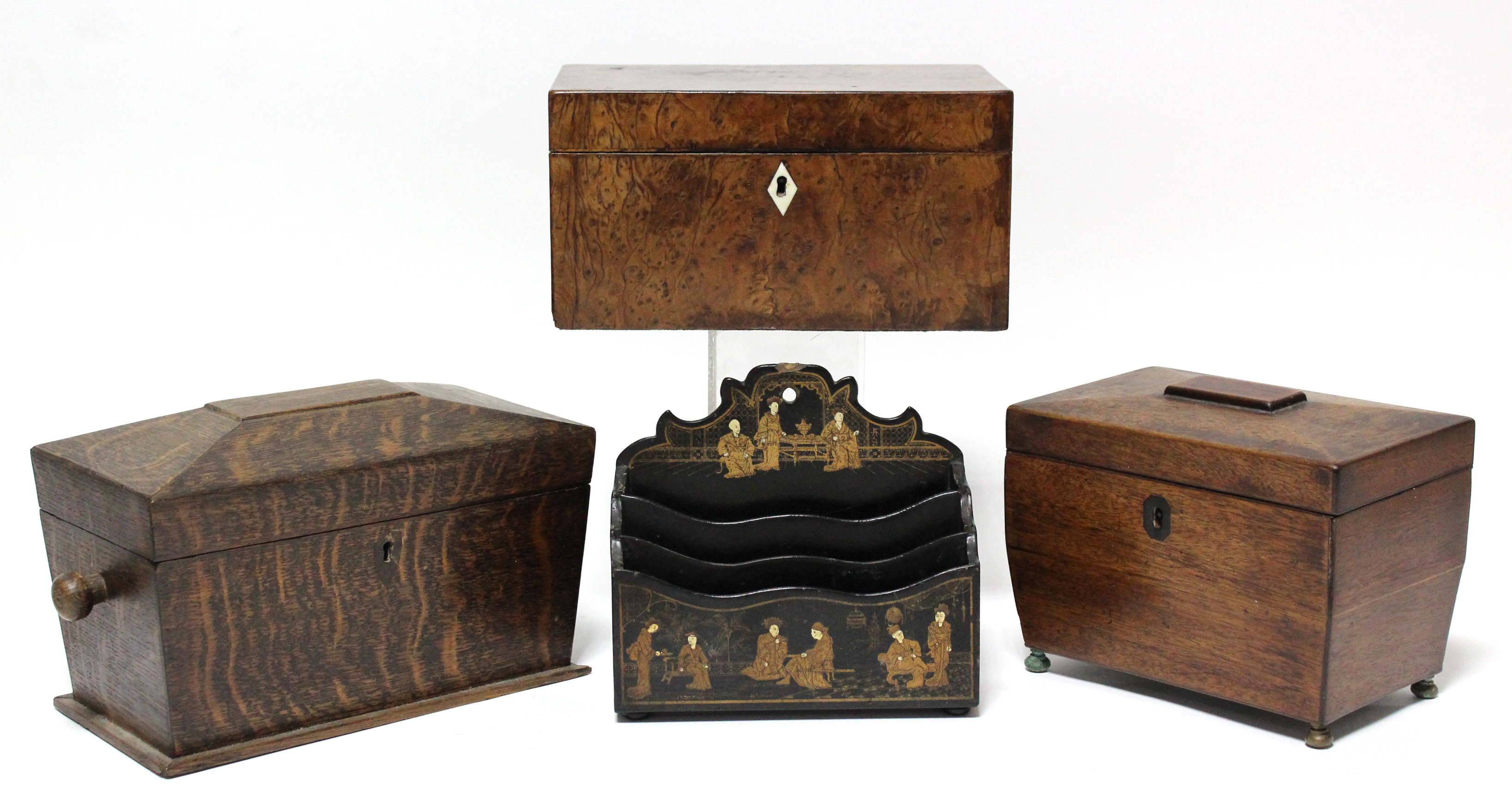 An early 19th century yew-wood two-division tea caddy of rectangular form with ivory escutcheon,