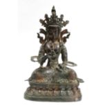 A SINO-TIBETAN BRONZE FIGURE VAJRAPANI seated dhyanasana on a double-lotus base with beaded edge,