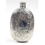 A Victorian silver oval flat-sided pocket spirit flask with all-over engraved decoration of leaf-