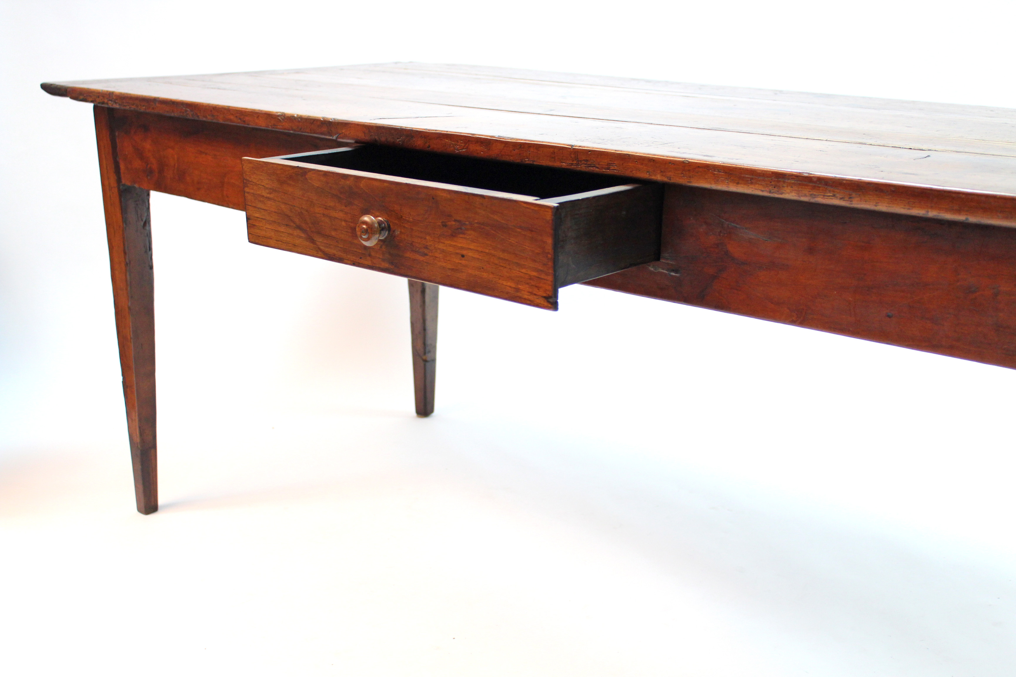 An antique French chestnut dining table, the rectangular top with cleated ends, fitted frieze drawer - Image 4 of 5