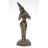 A Sino-Tibetan bronze standing figure of a Bodhisattva, with head tilted to the right, hands