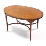 A 19th century Sheraton-style satinwood oval coffee table, with marquetry inlay & on splay legs; 35”